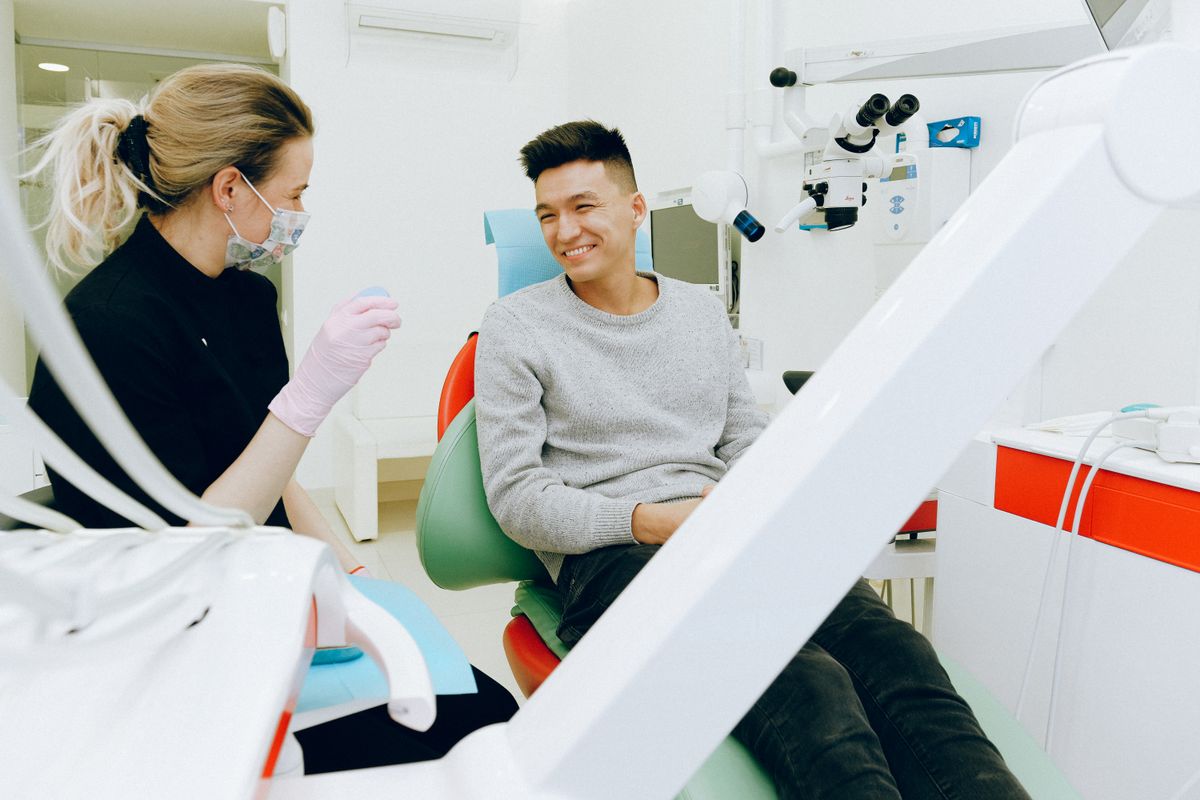Dentist consulting with a smiling patient